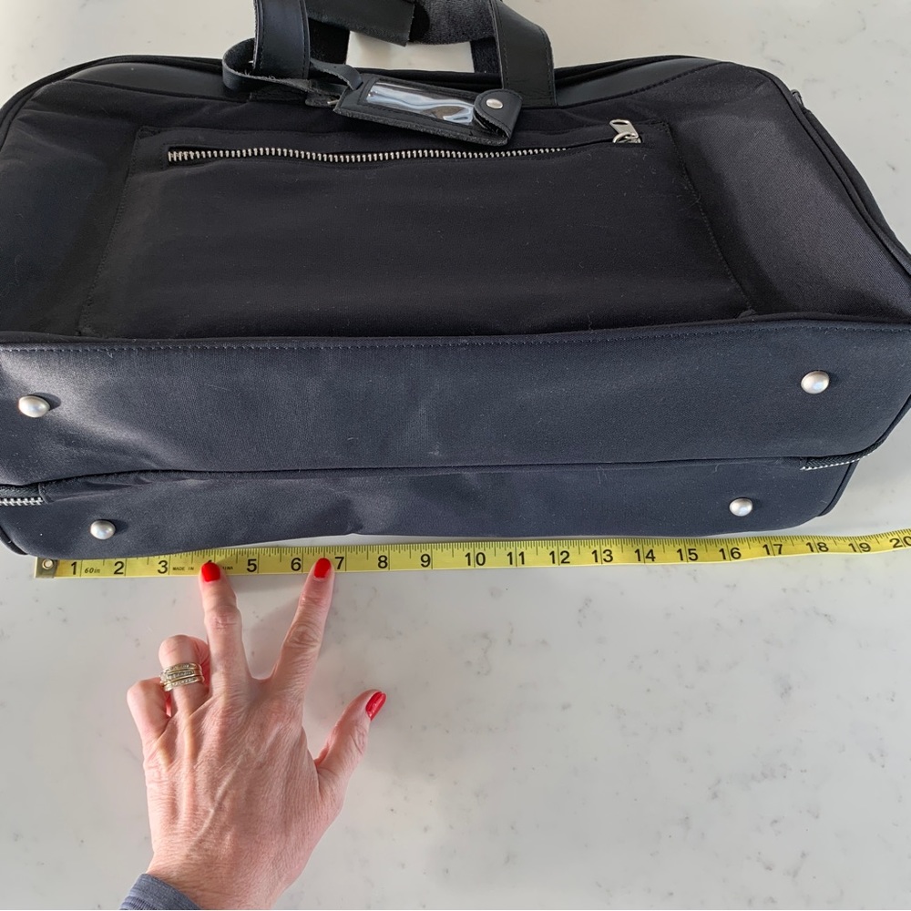 Black Travel Bag with Structured Design and Metal Feet - Picture 16 of 16